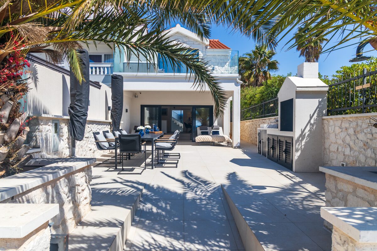 Outdoor living room with sofa and dining area on the terrace, The Beachhouse Rogoznica