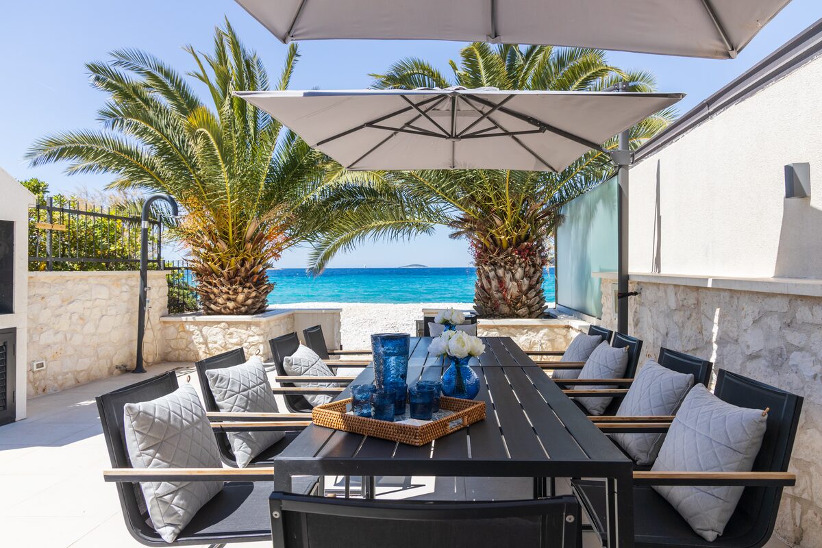 Terrace dining table looking onto the Adriatic