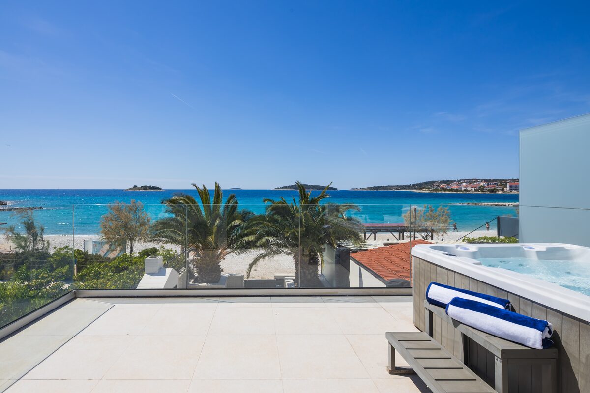 Heated whirlpool jacuzzi in daylight overlooking Rogoznica bay, The Beachhouse