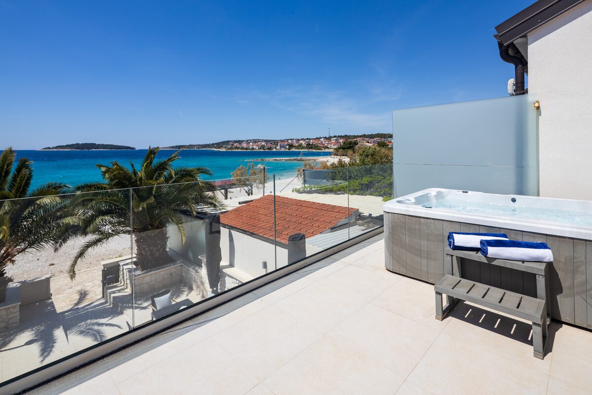 Heated whirlpool jacuzzi on the terrace at The Beachhouse Rogoznica