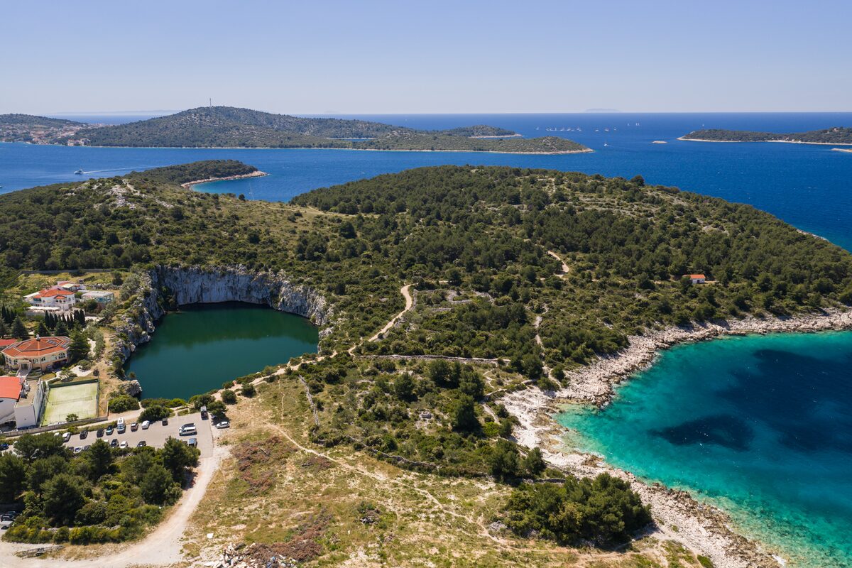Aerial view of the Rogoznica peninsula with pine-clad headlands at The Beachhouse Rogoznica