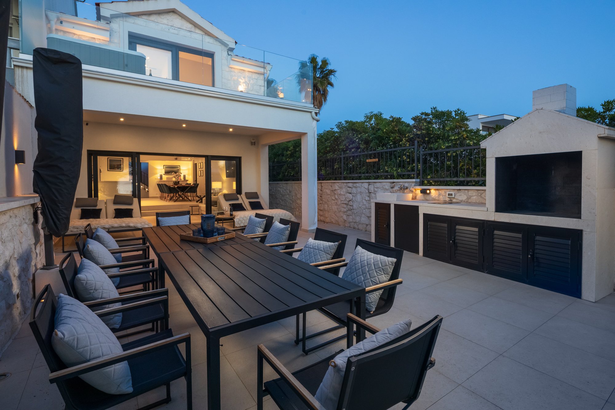 Sunset and evening on the terrace of The Beachhouse Rogoznica luxury villa overlooking the Adriatic