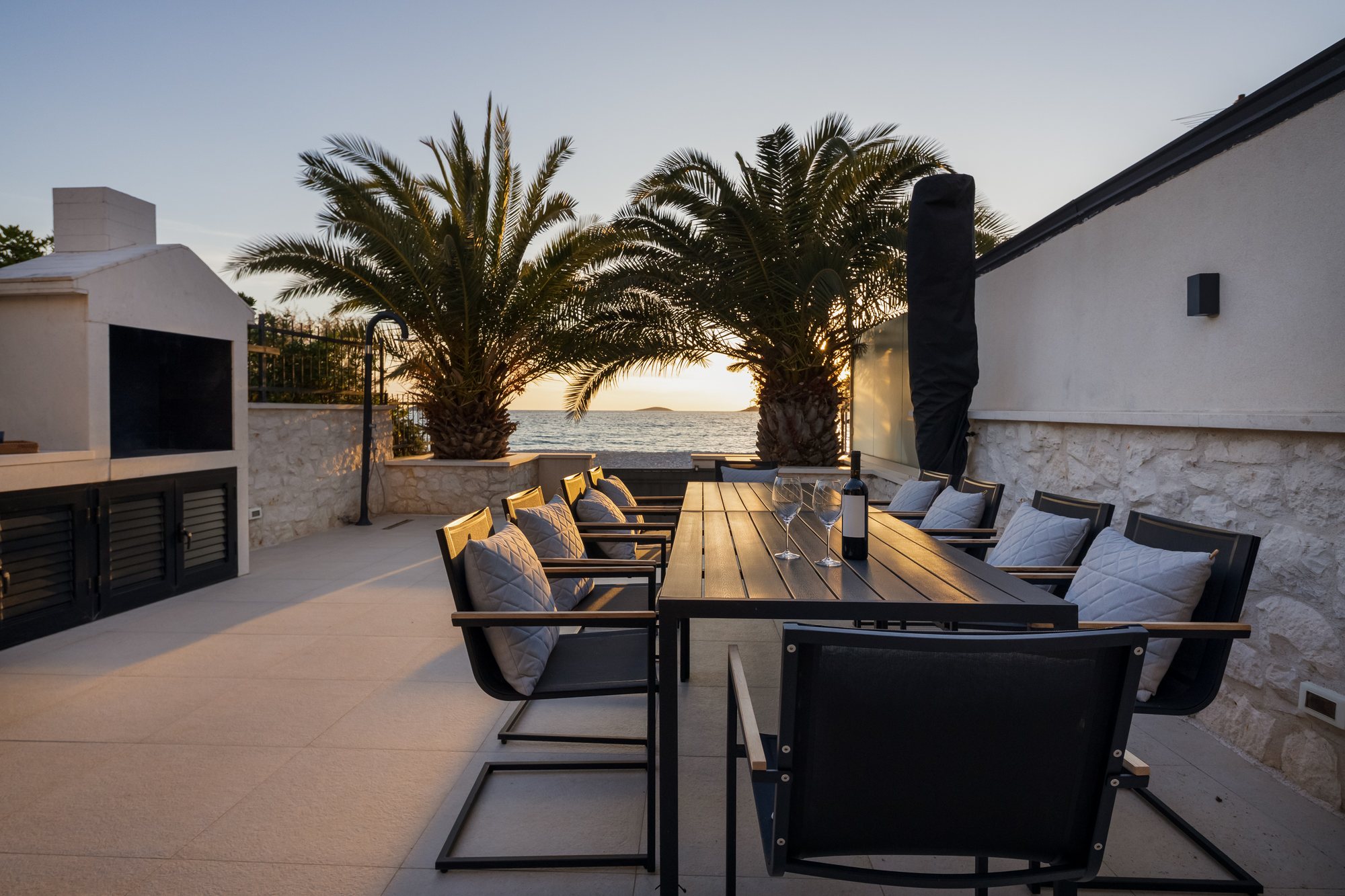 Sunset and evening on the terrace of The Beachhouse Rogoznica luxury villa overlooking the Adriatic