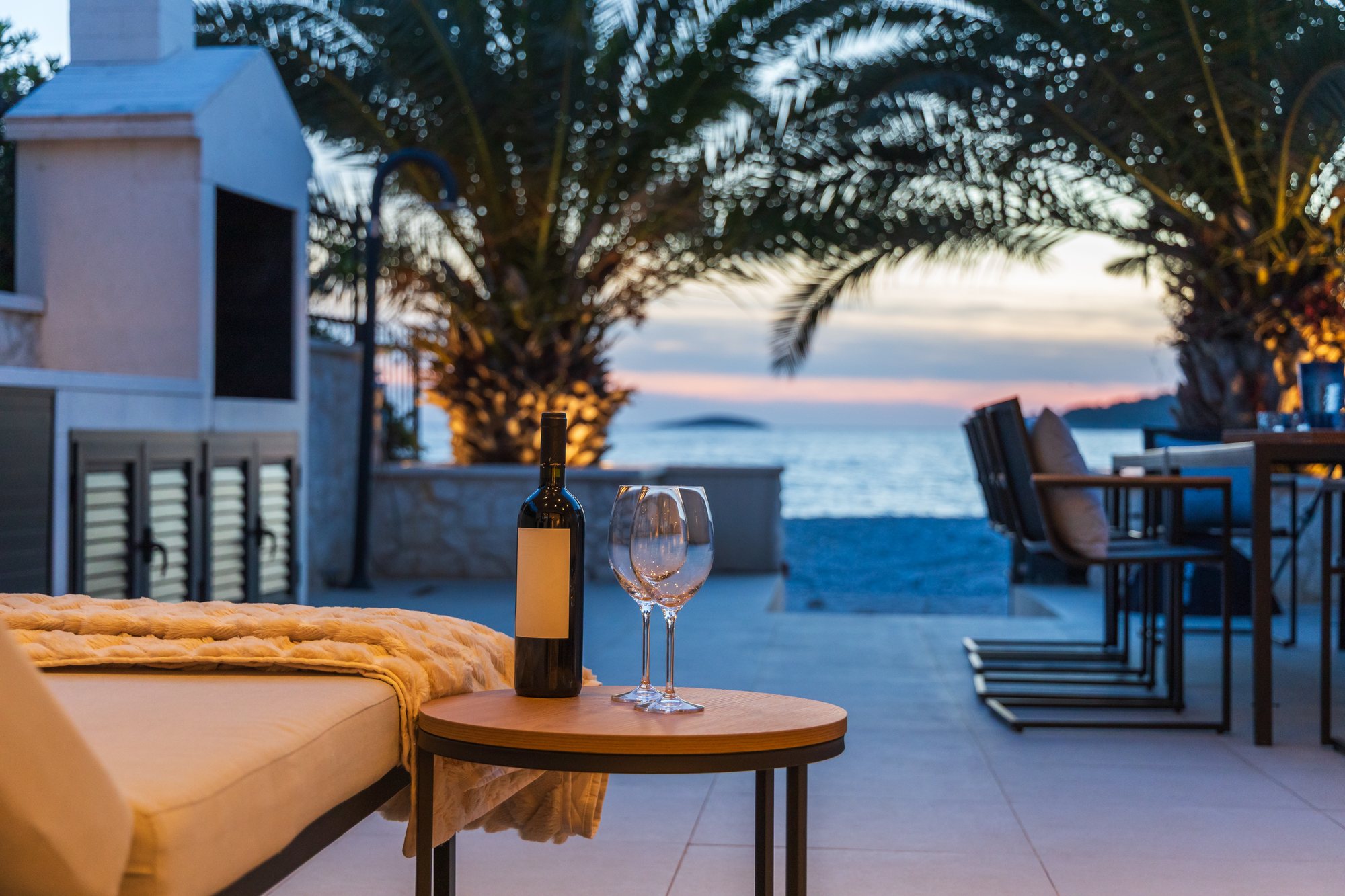 Sunset and evening on the terrace of The Beachhouse Rogoznica luxury villa overlooking the Adriatic