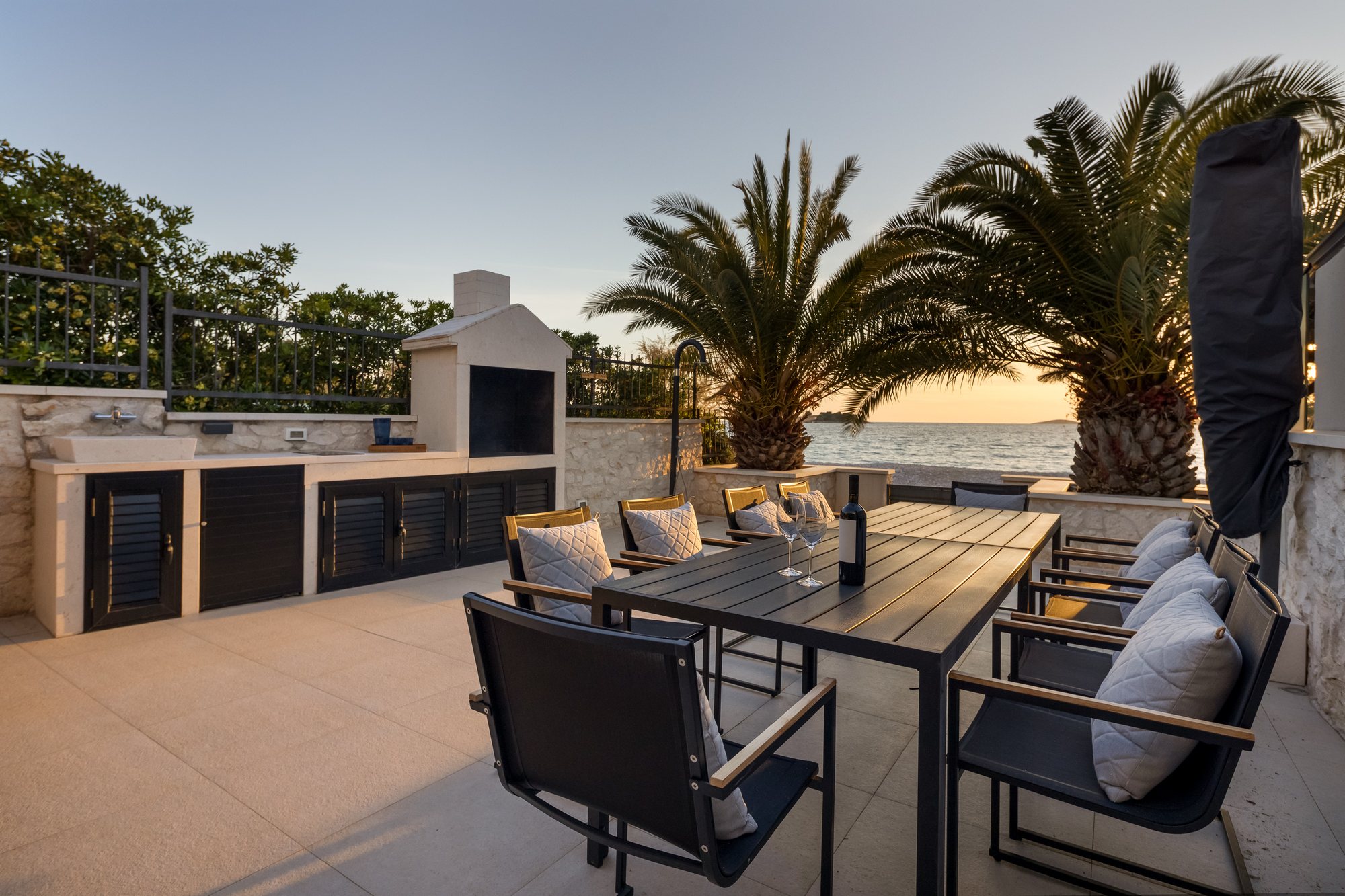 Sunset and evening on the terrace of The Beachhouse Rogoznica luxury villa overlooking the Adriatic